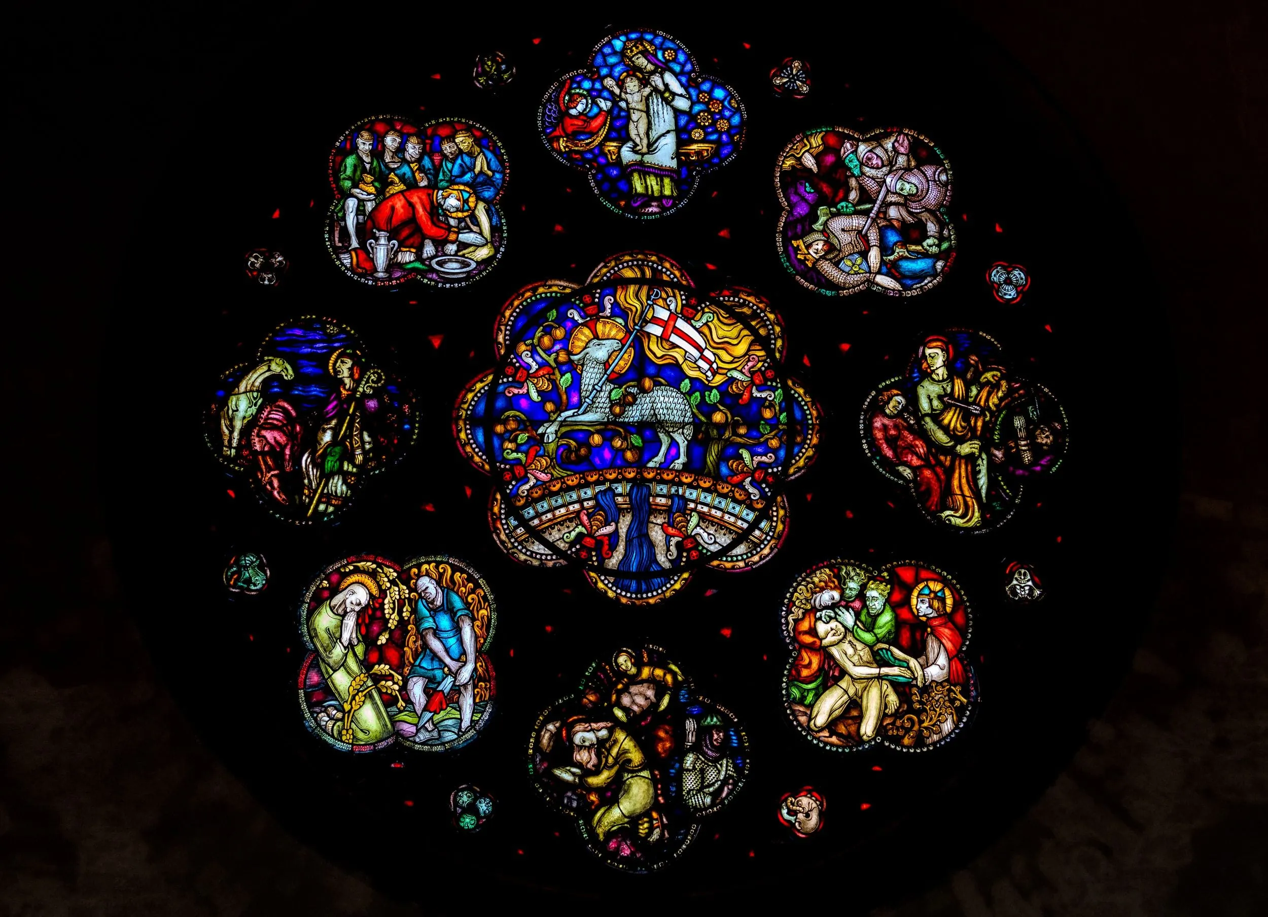 A cathedral rose window glowing with stained glass